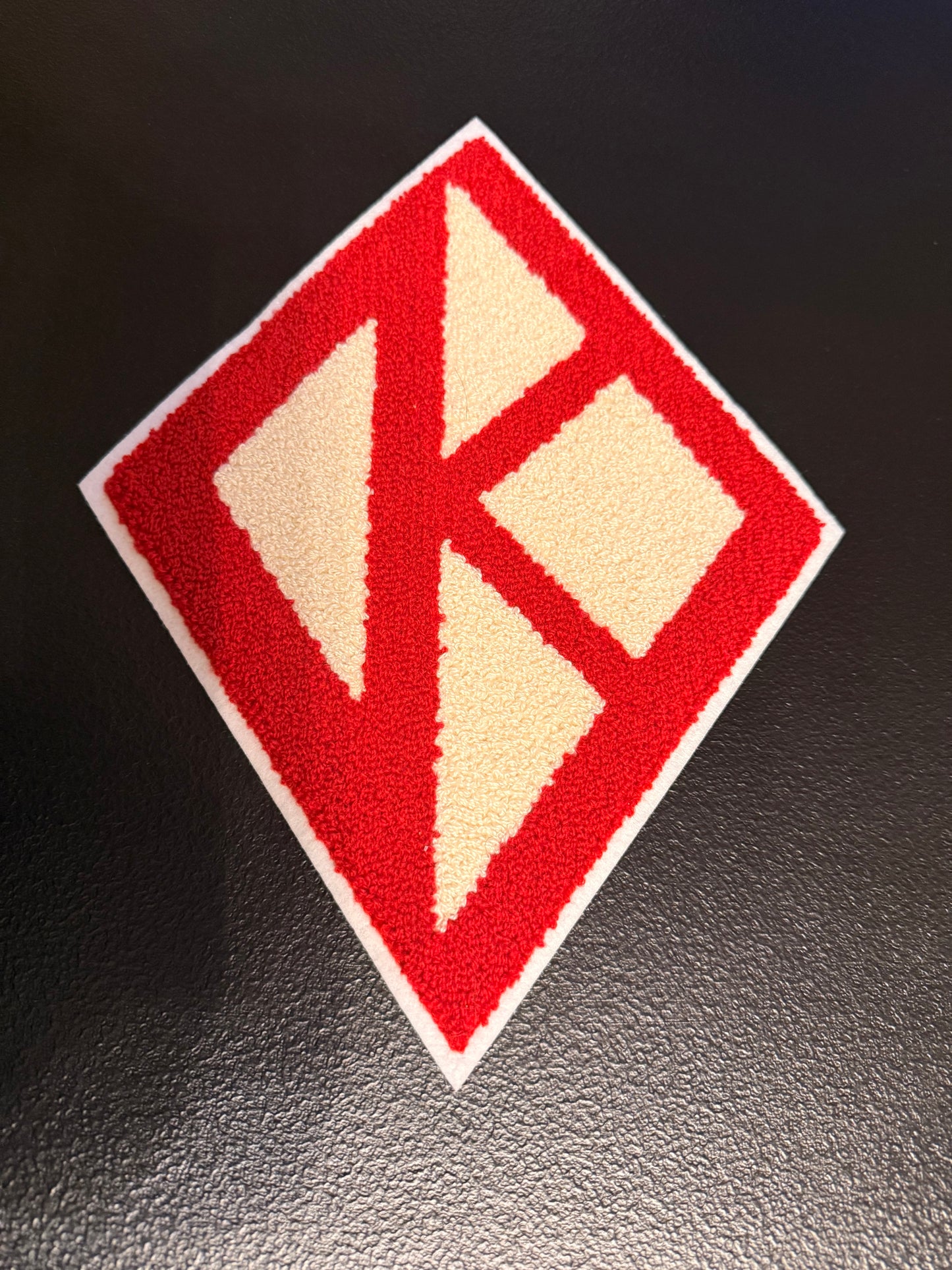 Floating K chenille patch