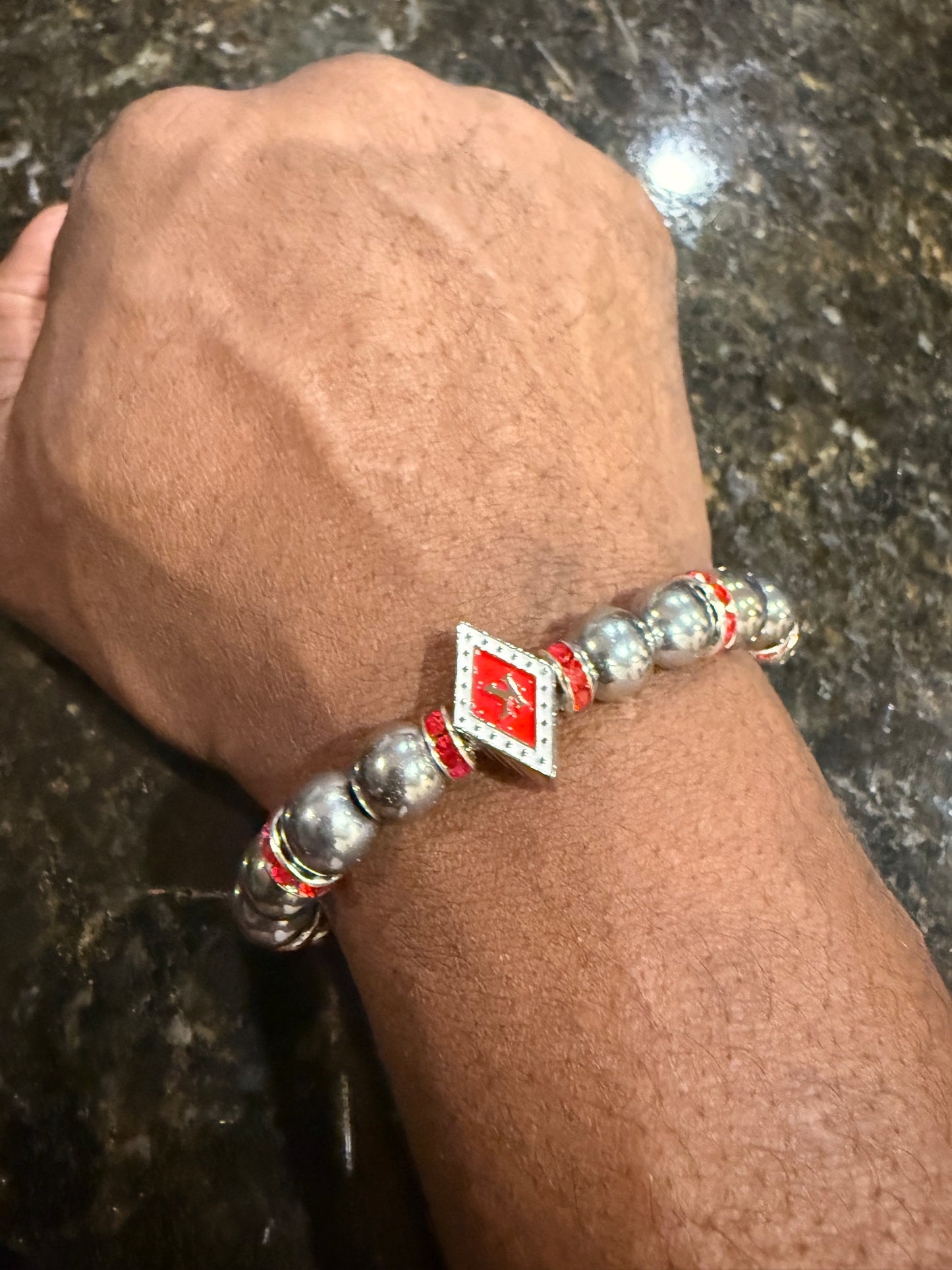 Red/White floating K hematite bracelet