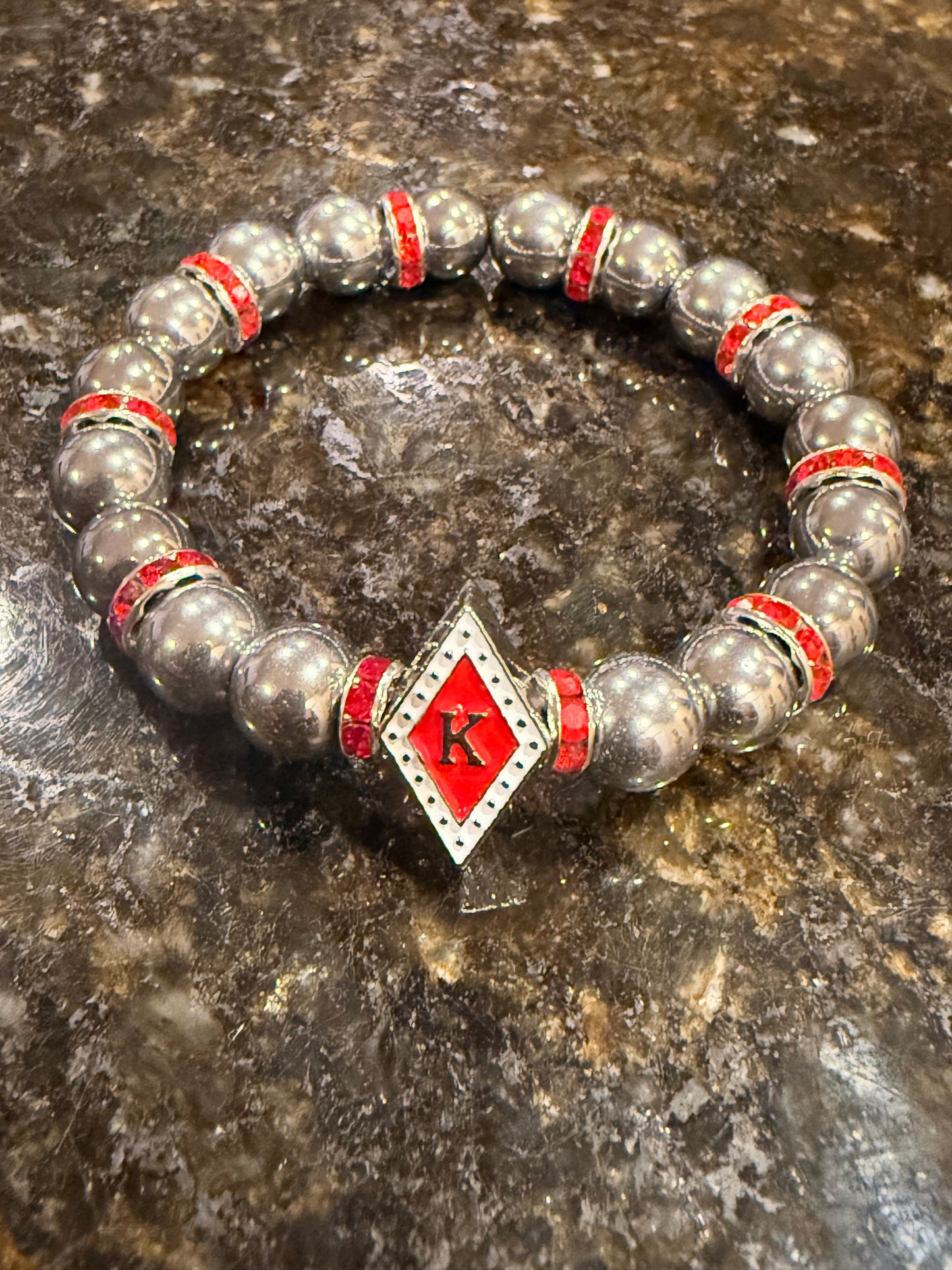 Red/White floating K hematite bracelet