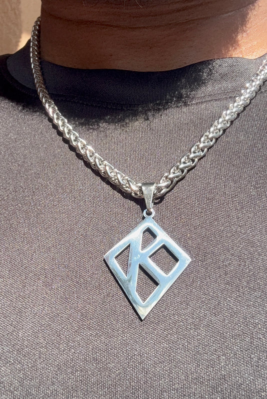 Floating K Stainless steel pendant on wheat chain