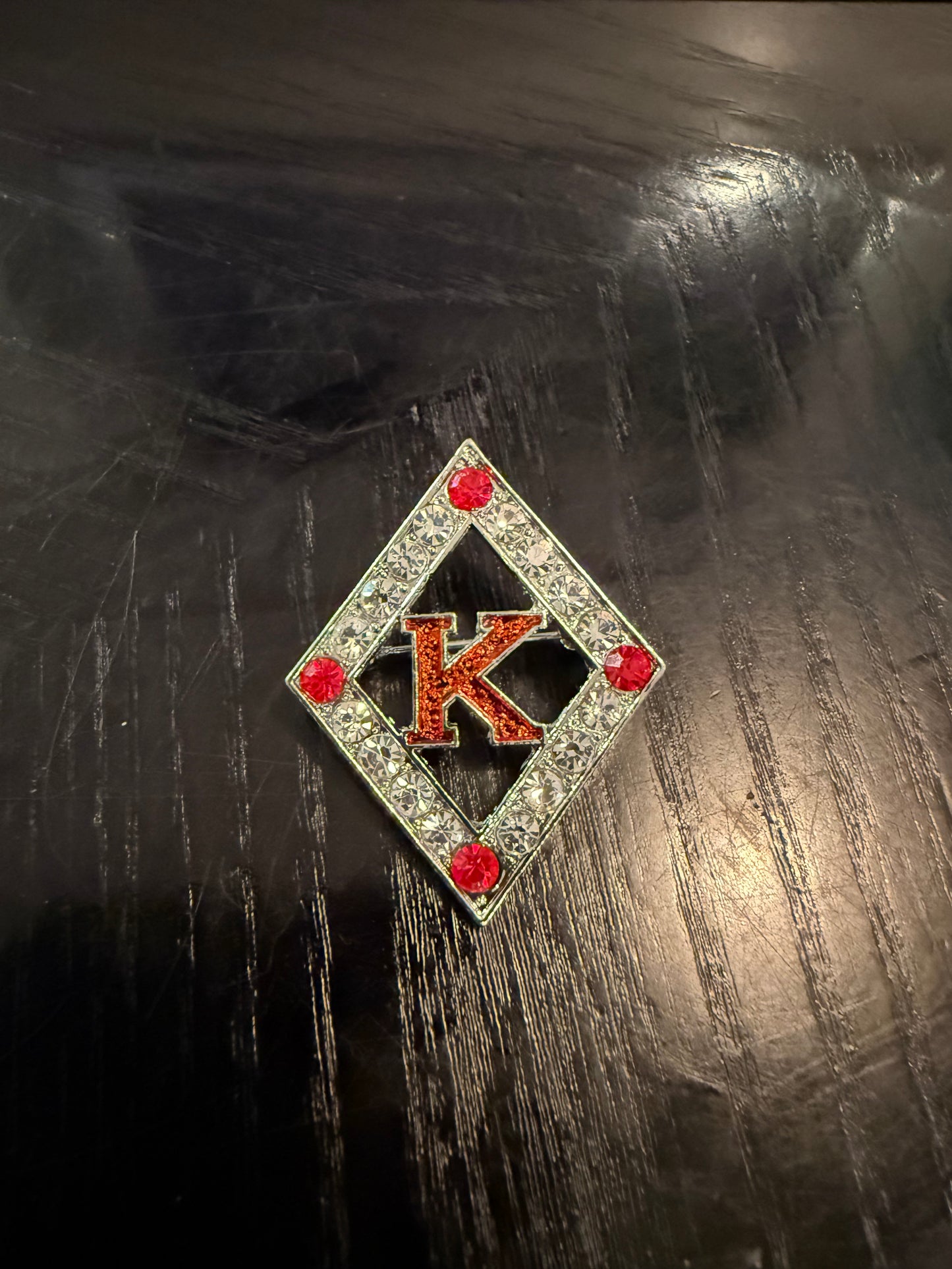 Floating 'K" Lapel pin