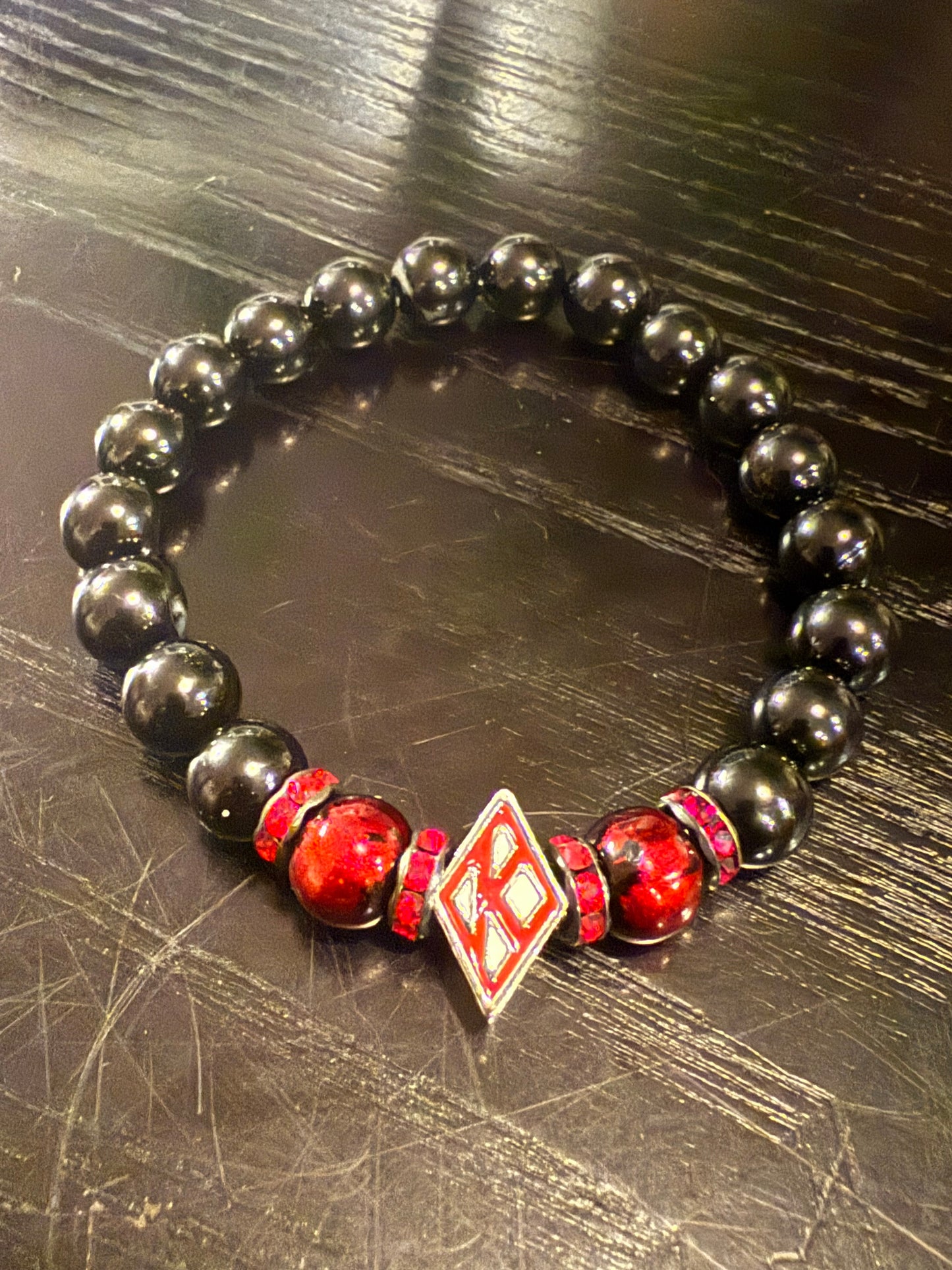 Floating "K" black beaded bracelet