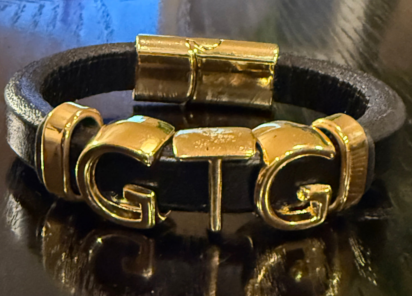 Gold Good Time Gang leather bracelet with gold lettering
