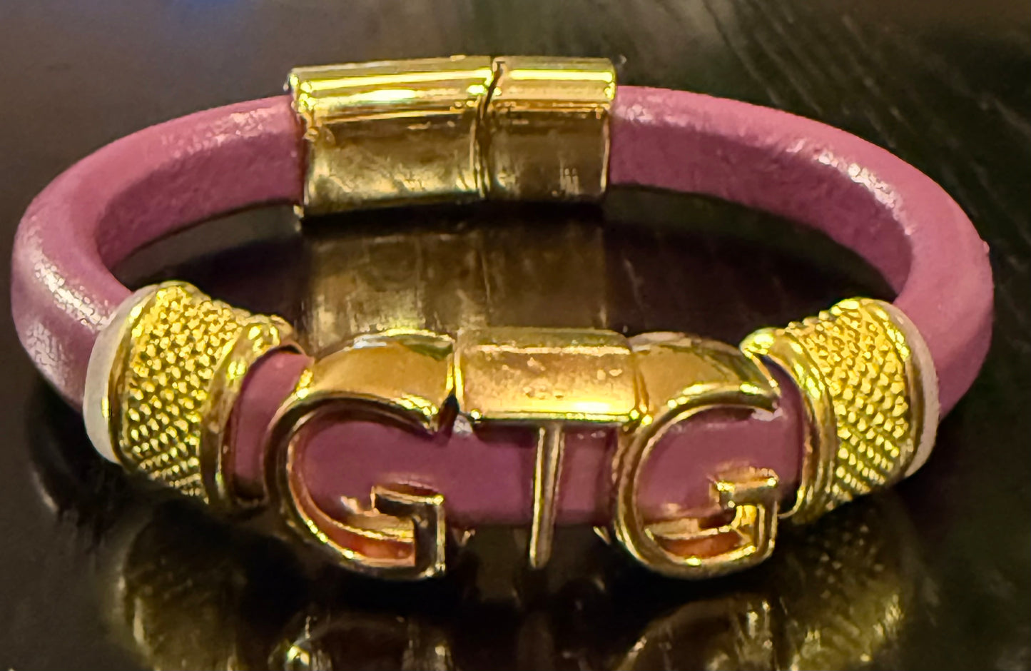 Gold Good Time Gang leather bracelet with gold lettering