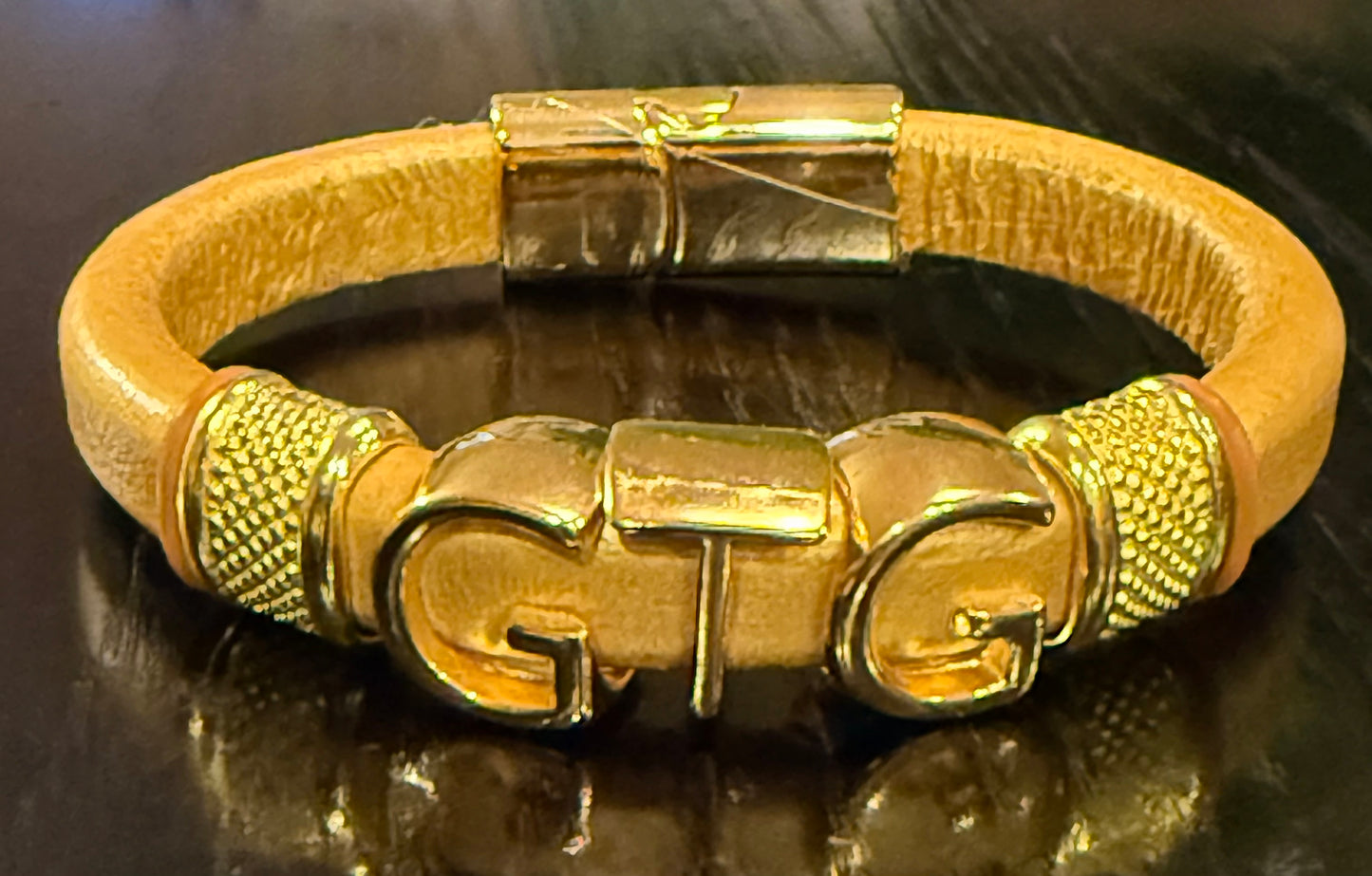 Gold Good Time Gang leather bracelet with gold lettering