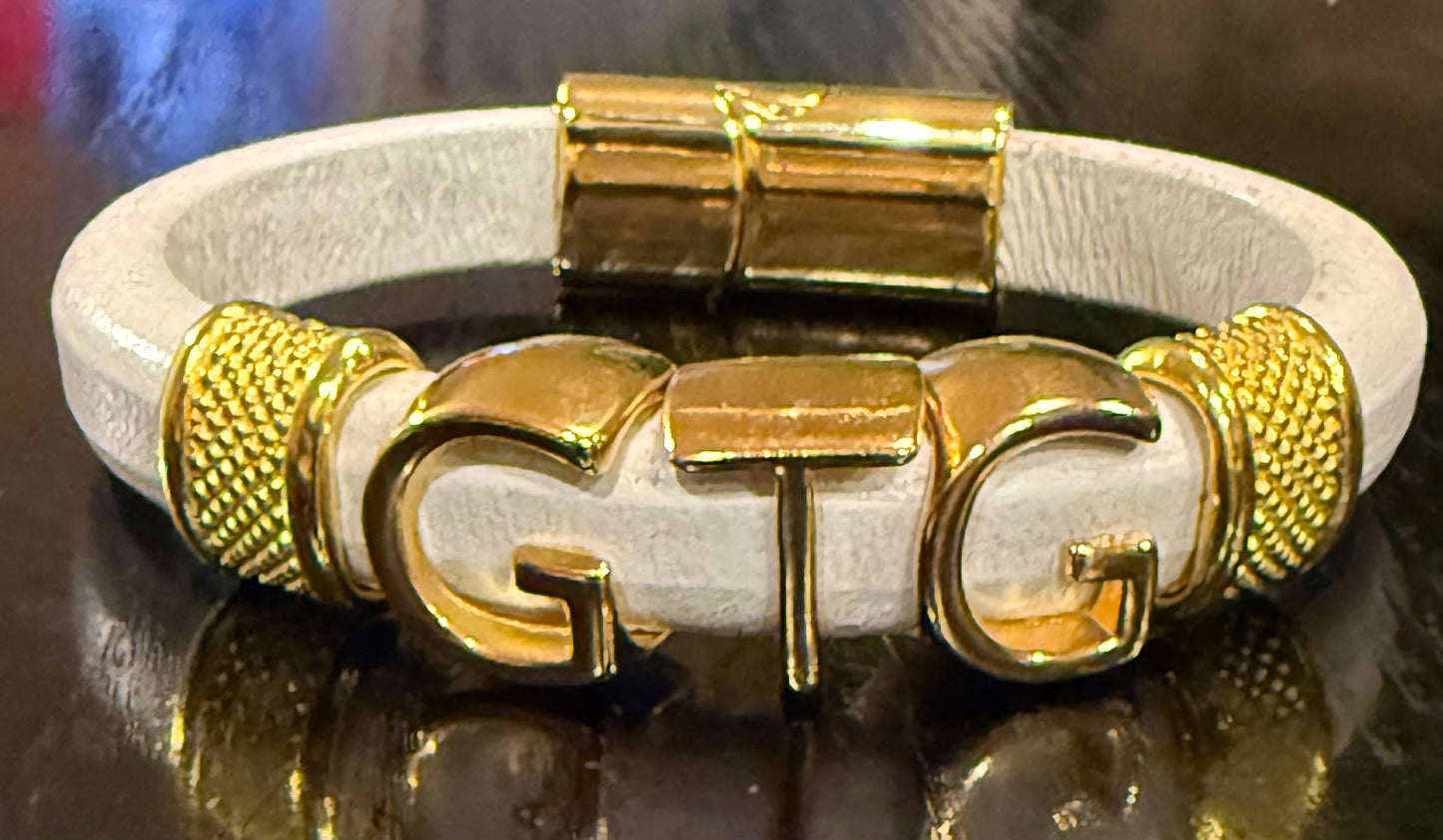 Gold Good Time Gang leather bracelet with gold lettering